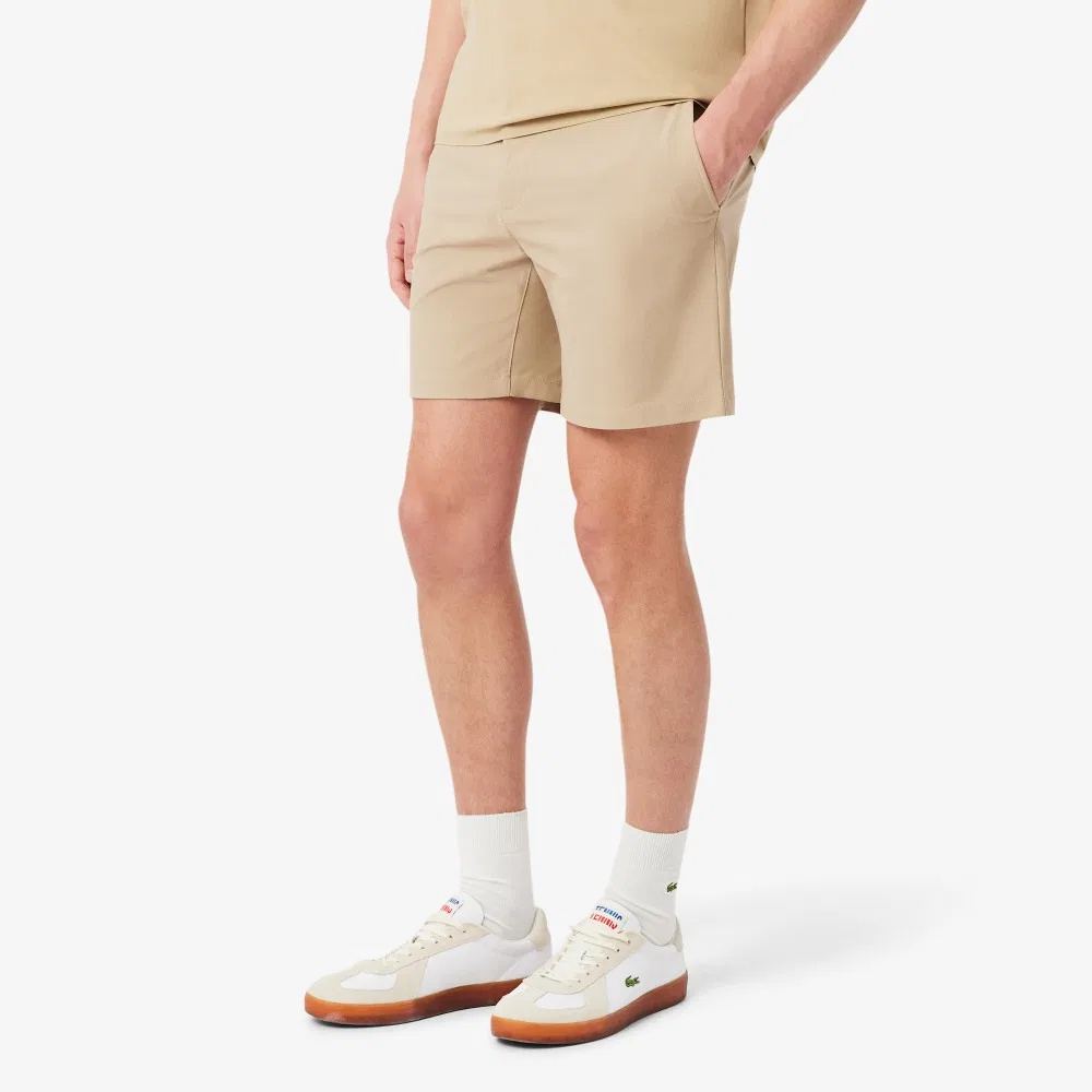 Мужские эластичные шорты-бермуды из полиэстера бежевые от Lacoste — фото 2