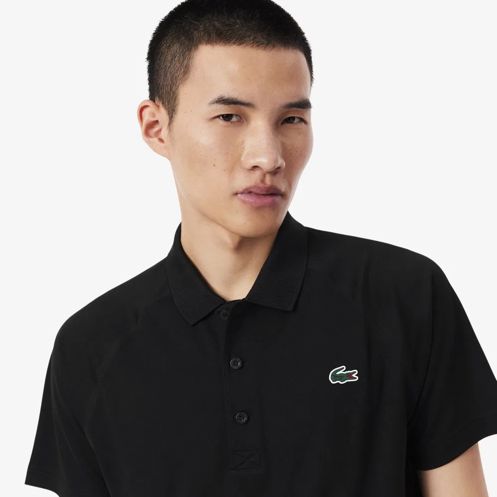 Мужская чёрная базовая футболка-поло с рукавами реглан от Lacoste — фото 2