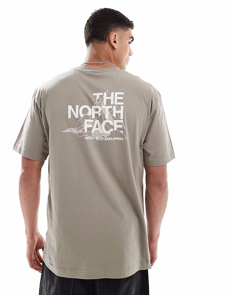 

Футболка оверсайз The North Face Explore в выцветшем зеленом цвете с принтом на спине