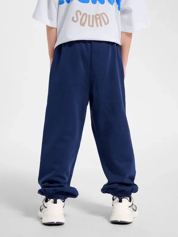 Спортивные штаны Hummel Hmljr jump boxy elastic tracksuit bottoms, средневековый синий — фото 3
