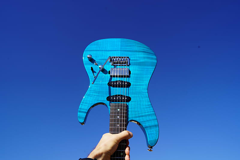 

Электрогитара Ibanez Signature MMN1 Martin Miller - Transparent Aqua Blue 6-String Electric Guitar w/ Hardshell Case