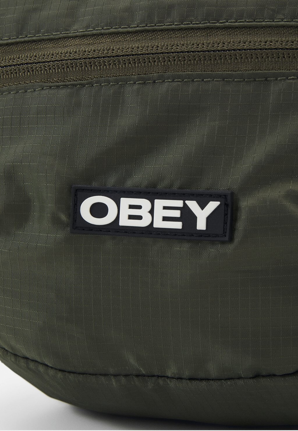 

Поясная сумка COMMUTER WAIST BAG UNISEX Obey Clothing, оливковый