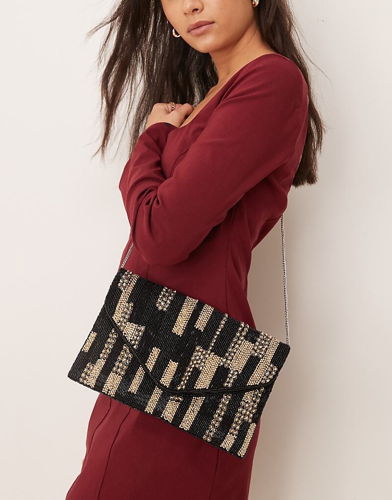 

True Decadence – украшенный черно-золотой клатч