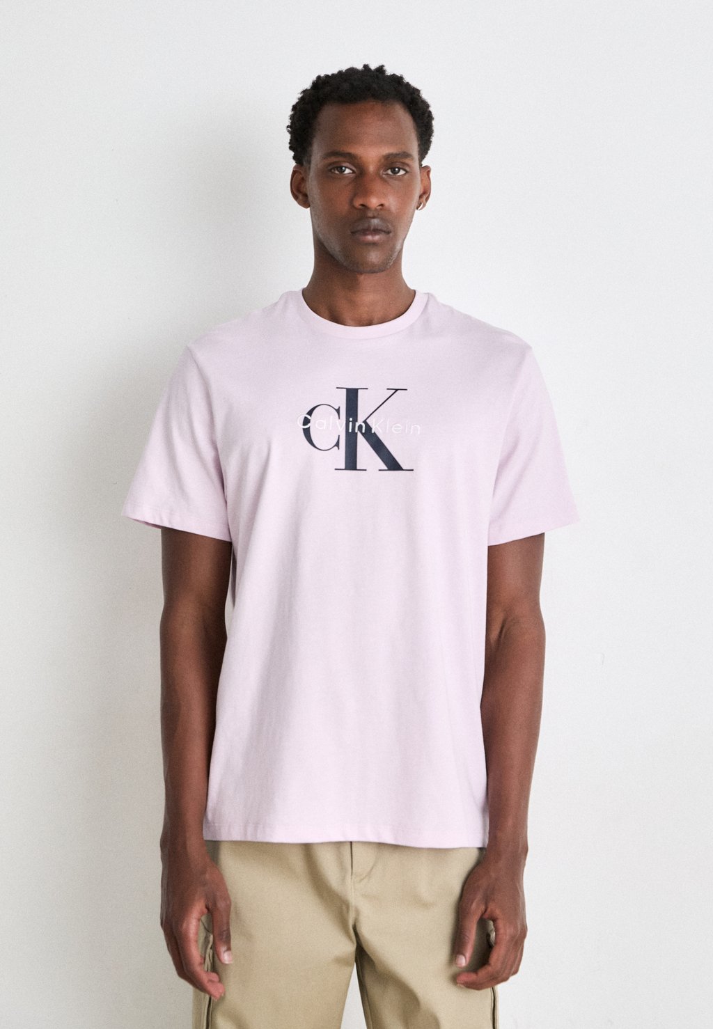 

Футболка с принтом HERO MONOLOGO TEE Calvin Klein Jeans, светло-розовый