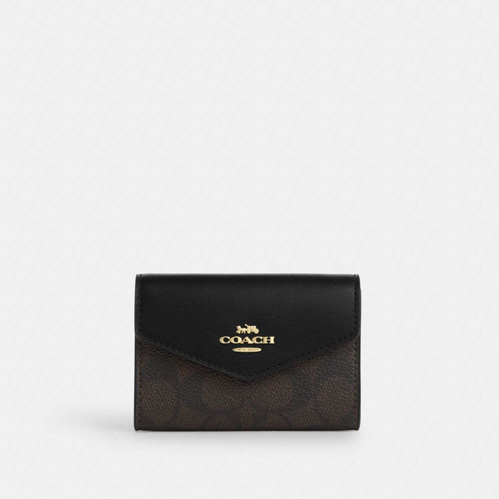 

Кошелек Coach Flap Card Case, золотой/ореховый/черный