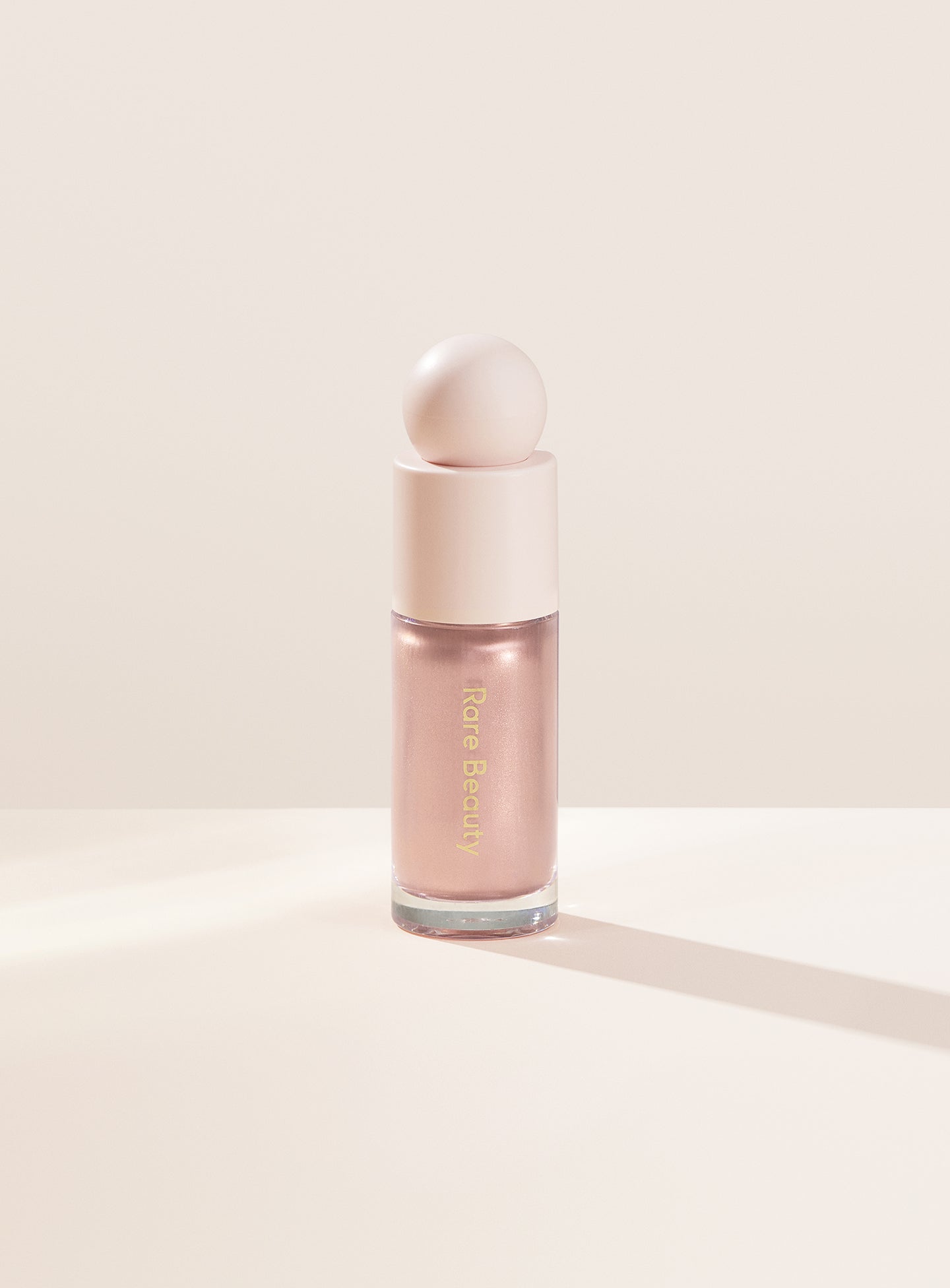 

Жидкий люминайзер Positive Light Rare Beauty, цвет enchant/soft pink, 15 мл