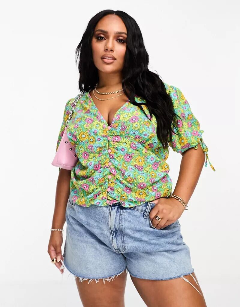 

Повседневная блузка на пуговицах с рюшами на талии ASOS DESIGN Curve с ярким ромашковым принтом