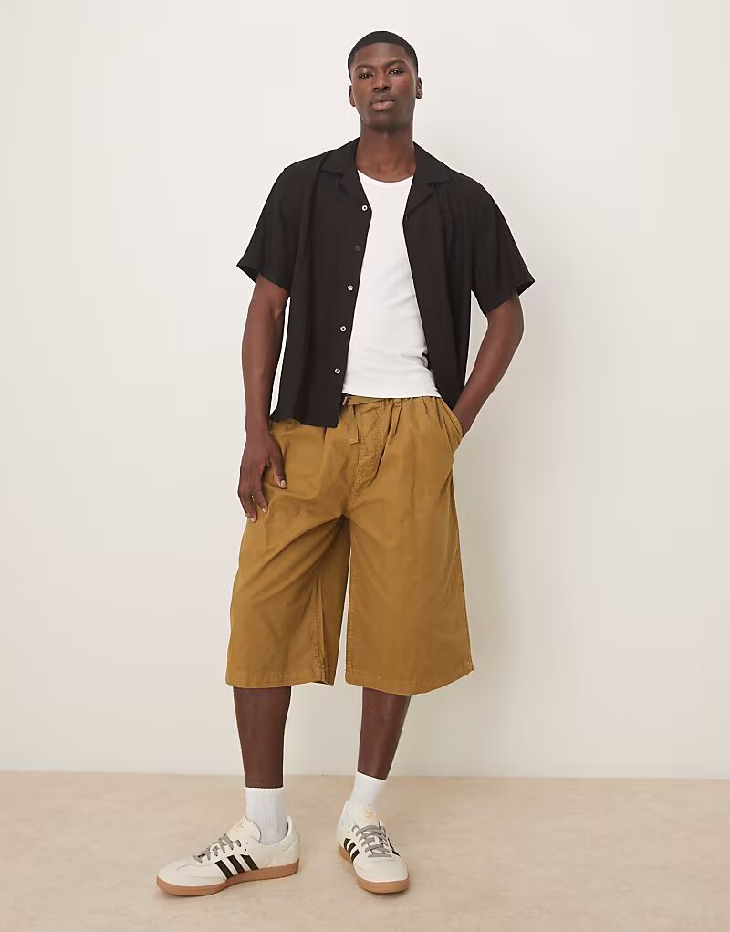 

Удлиненные шорты ASOS DESIGN оливкового цвета с поясом и складками