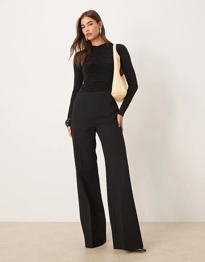 

Текстурированный комбинезон с длинными рукавами Mango черного цвета