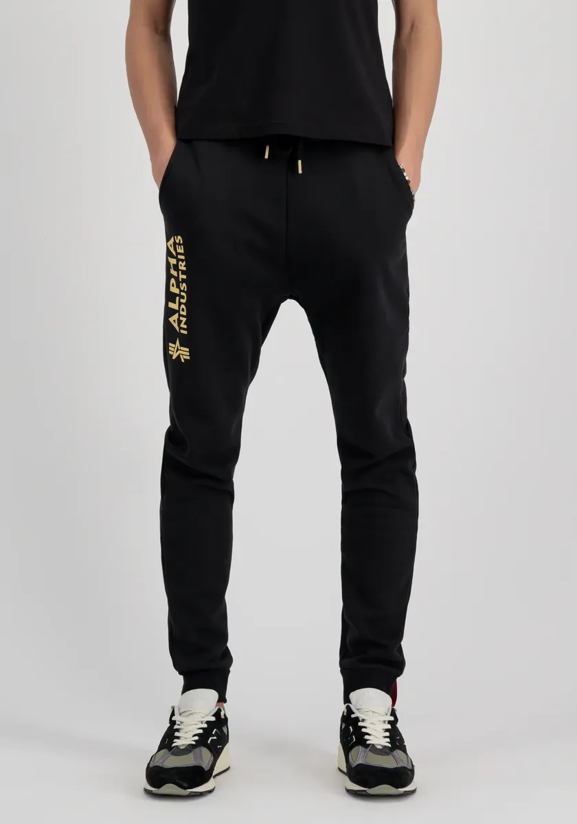 

Брюки для бега Alpha Industries " Alpha Industries Мужчины - Jogger Basic Jogger AI Foil Print", цвет Black/Yellow Gold