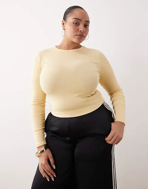 

Пахтовый топ с круглым вырезом в рубчик и длинными рукавами ASOS DESIGN Curve