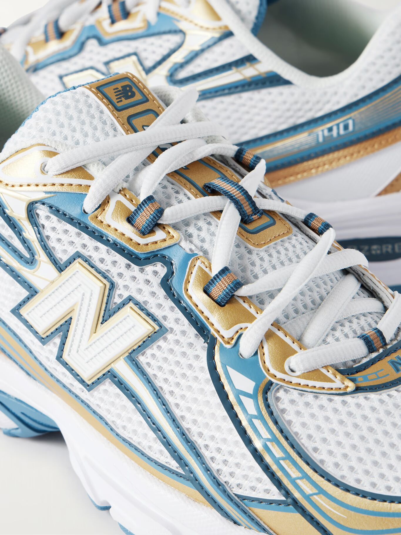 

740 Кроссовки из сетки с металлической отделкой NEW BALANCE, синий