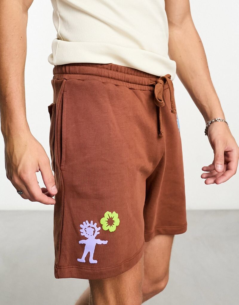 

Коричневые шорты оверсайз с многослойным принтом ASOS DESIGN