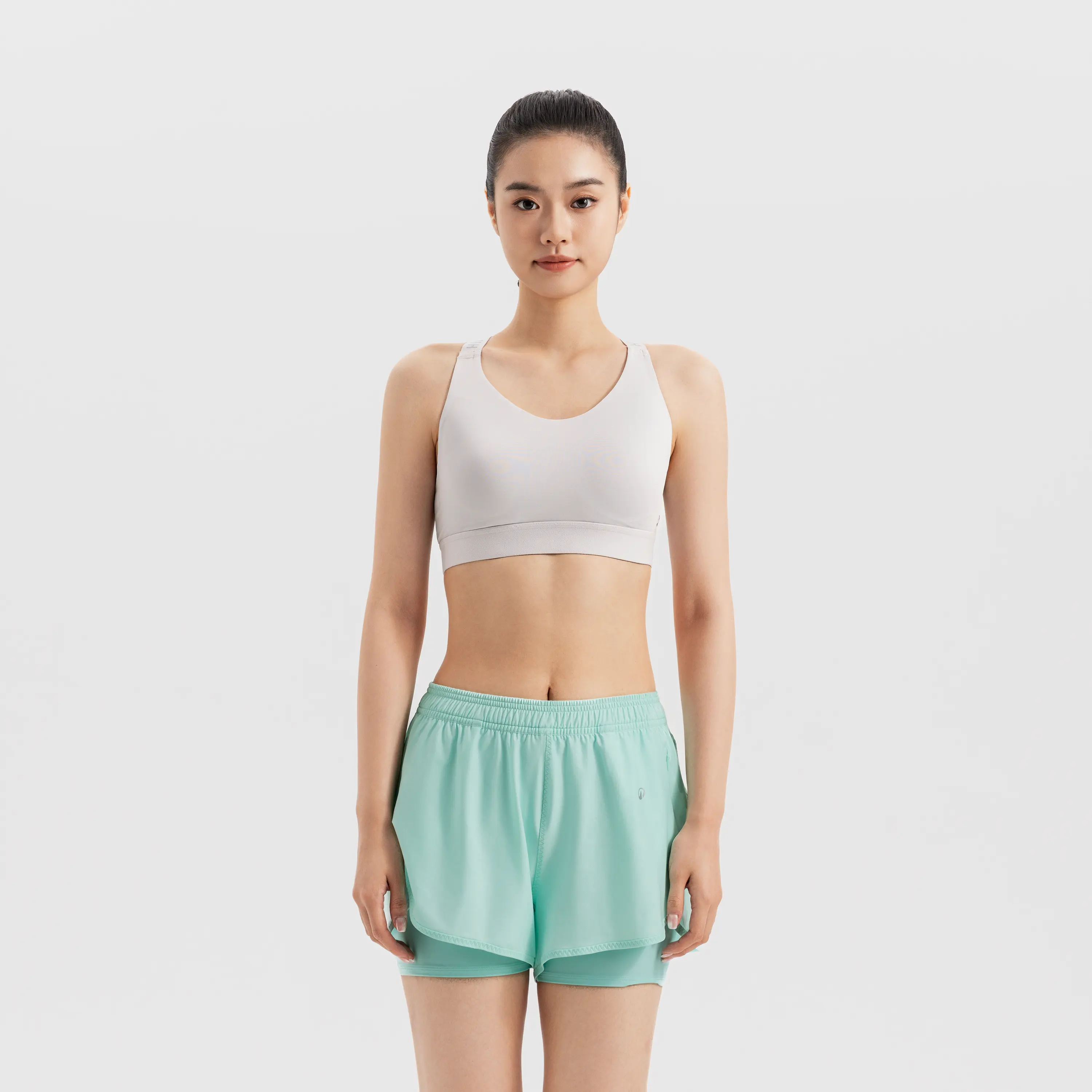 

Женское спортивное бельё высокой поддержки с перекрестными лямками Decathlon в светло-сером цвете