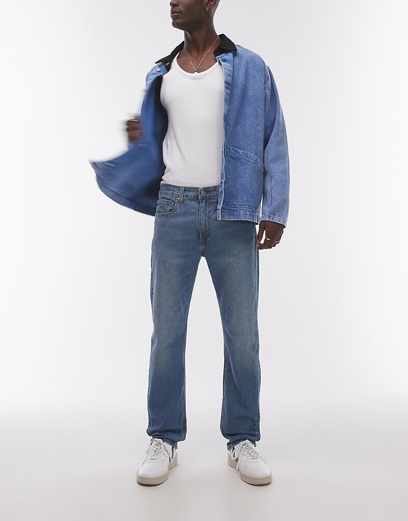 

Стильные джинсы из зауженного кроя Levi's 502 темно-синего цвета