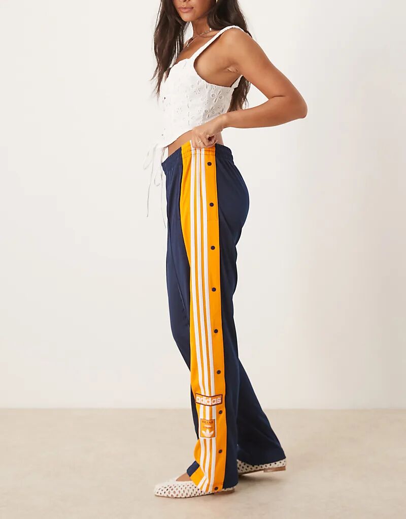 

Спортивные брюки adidas Originals Adibreak темно-синего и оранжевого цветов