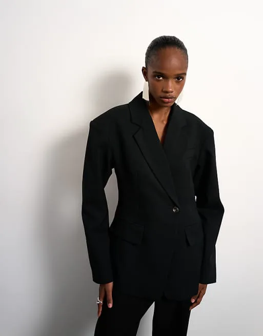 

Черный блейзер с объемными плечами и завязками Topshop