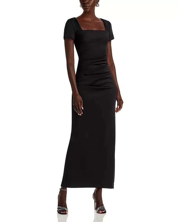 

Эксклюзивное макси-платье из ткани «дайвинг» с открытой спиной и короткими рукавами. Aqua, черный