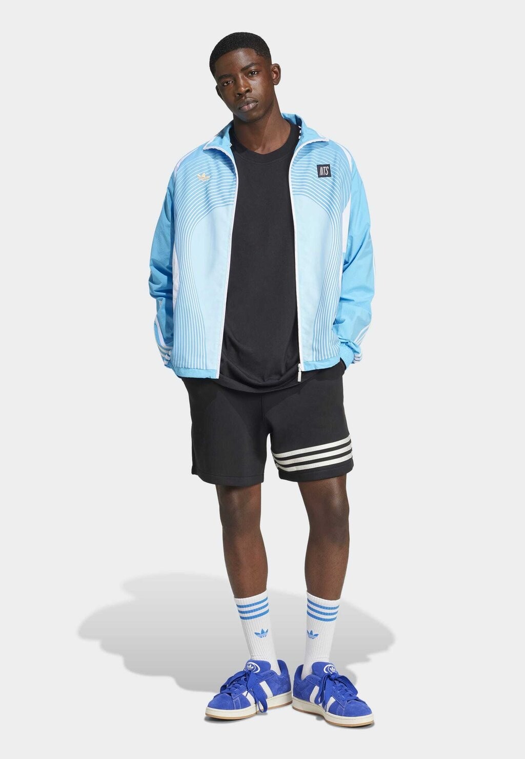 

Тренировочная куртка ADIDAS NTS RADIO ALLOVER PRINTED SUPERSTAR TRACK adidas, светло-голубой