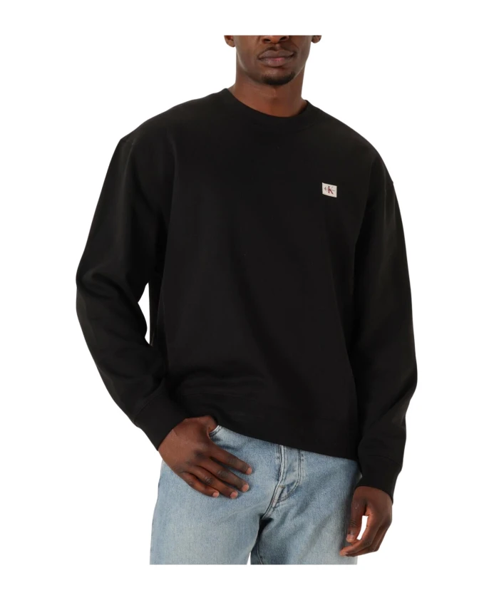 

Черный пуловер с длинными рукавами и эмблемой ЕС Calvin Klein, черный