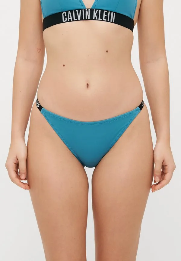 Дерзкие трусики-стринги от бикини Calvin Klein Swimwear, Storm Blue