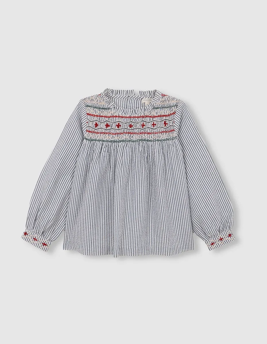 

Блузка для девочки в полоску с ручной вышивкой «гнездо пчелы» светло-голубого цвета Gocco