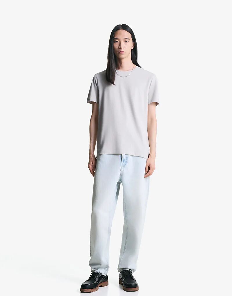

Джинсы Bershka Tapered свободного кроя светло-синего цвета