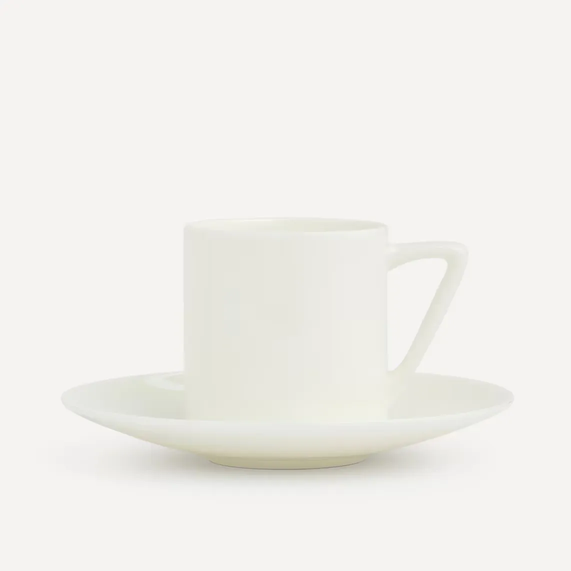 

Кофейная чашка с круглым блюдцем и крылышком Bone China Essential El Corte Inglés, белый