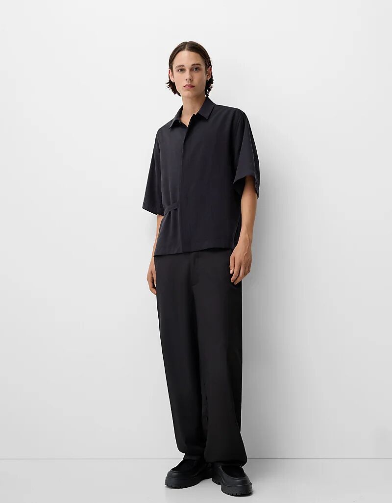 

Коллекция мешковатых брюк черного цвета Bershka