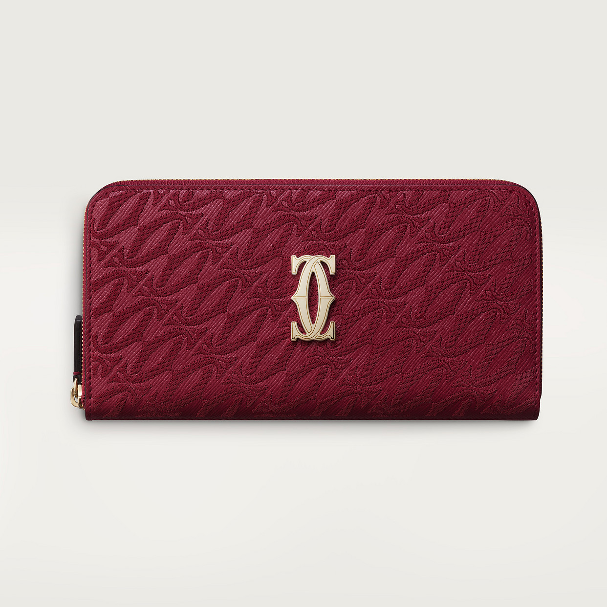 

Кошелек Cartier Portefeuille international zippé, C de Cartier, текстурированная телячья кожа вишнево-красного цвета