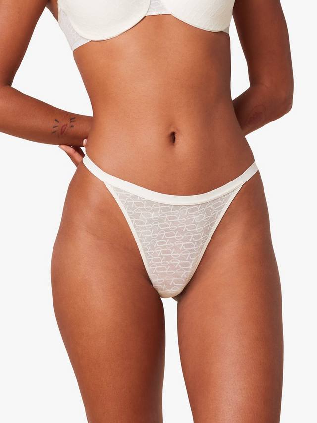 

Сигнатурный прозрачный стринги на завязках Triumph, Ecru White