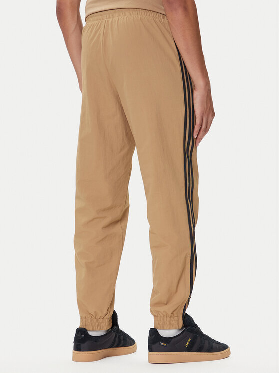 Джоггеры regular fit adicolor Woven Firebird JY1339 Adidas, бежевый — фото 3