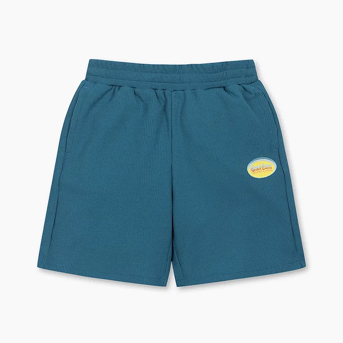 Детские бирюзовые вафельные шорты-бермуды от Benetton Kids