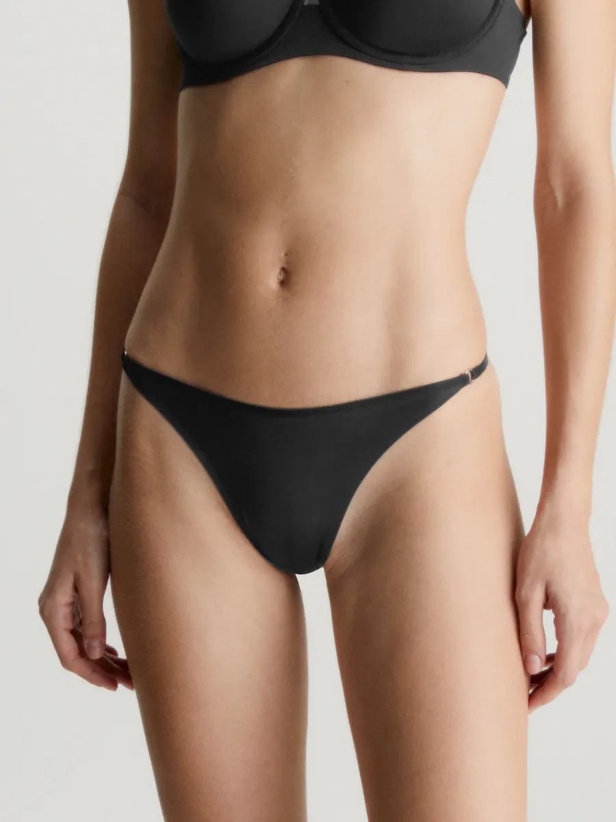 

Трусики Calvin Klein Underwear "THONG", с декоративным кольцом золотистого цвета сбоку, черный