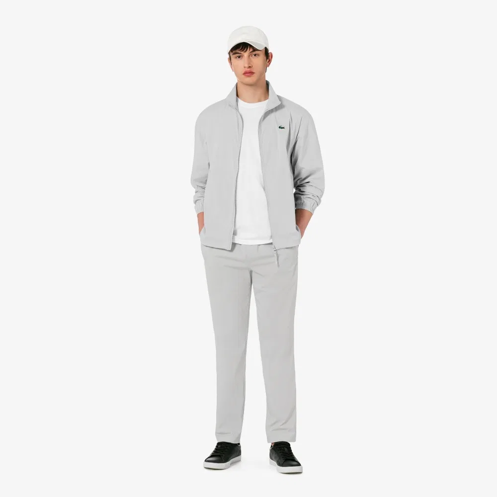 Мужские лёгкие серые брюки из тканого материала от Lacoste