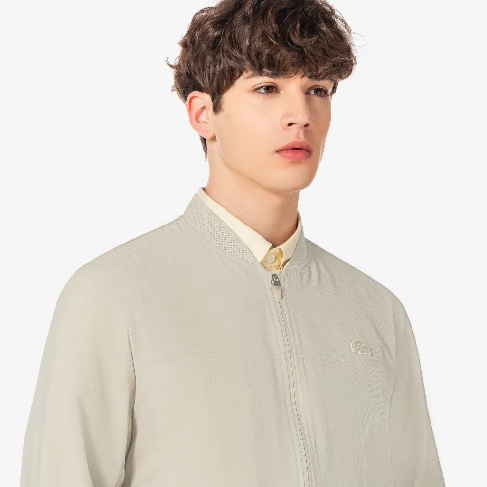 Мужская летняя куртка для гольфа бежевая от Lacoste — фото 2