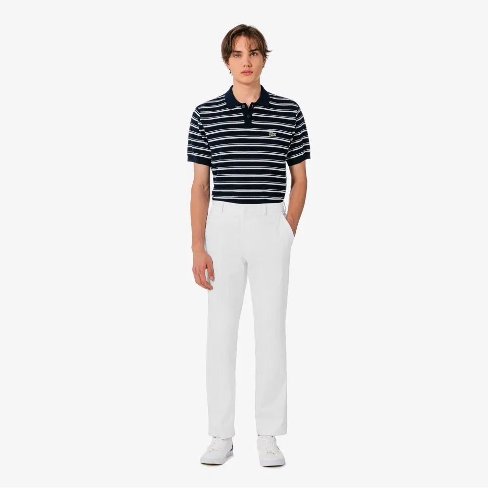 Мужские весенние эластичные брюки цвета офф-вайт от Lacoste