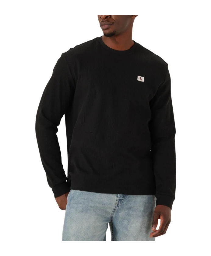 

Черная футболка с длинными рукавами и вафельной нашивкой. Calvin Klein, черный