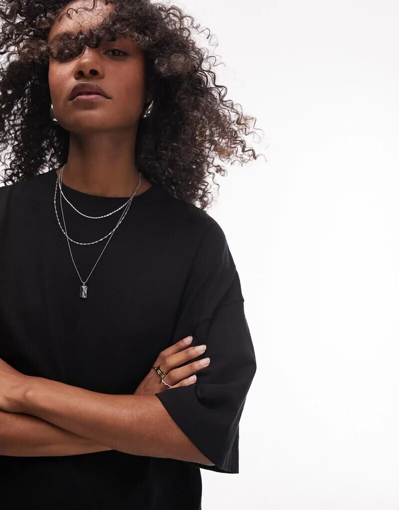 

Черная футболка оверсайз с заниженными плечами Topshop