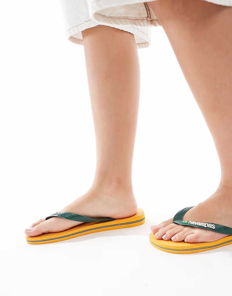 Шлепанцы унисекс с бразильским логотипом Havaianas желтого цвета — фото 3