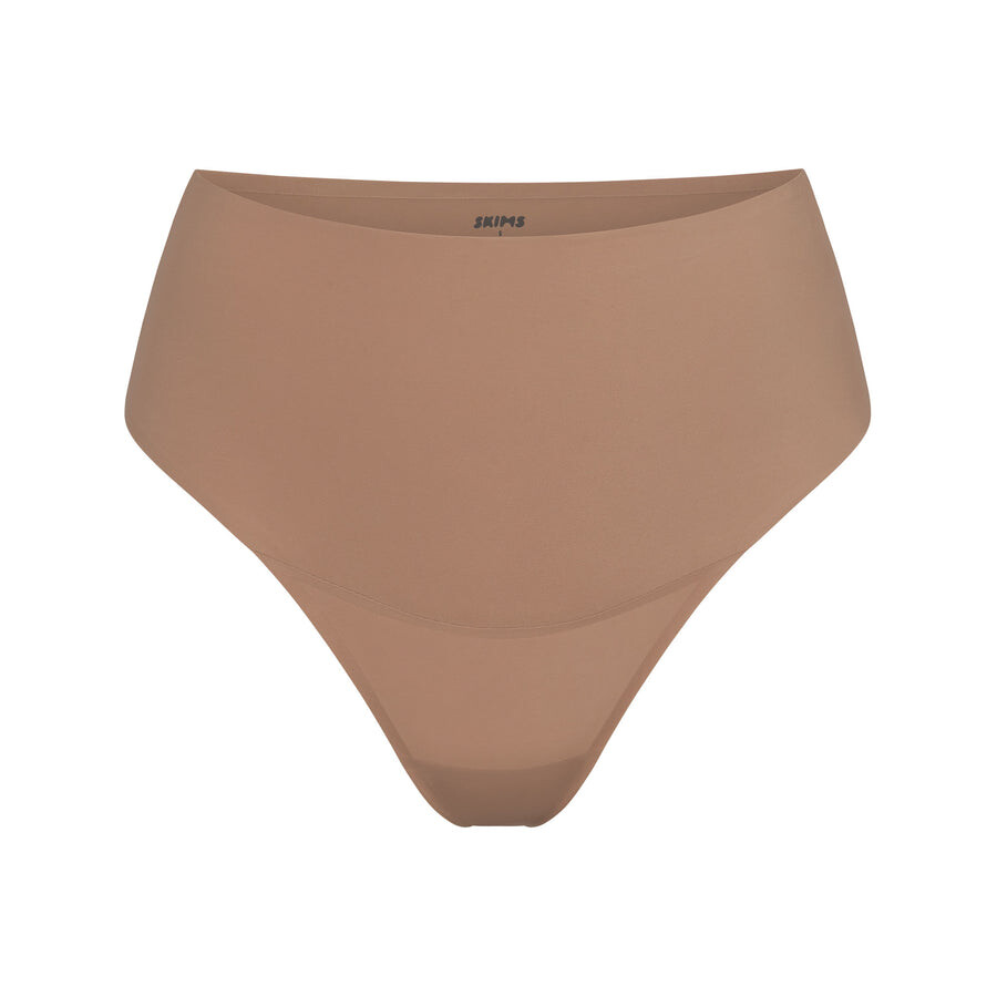 

Стринги с высокой талией SKIMS Smoothing Intimates, цвет Sienna