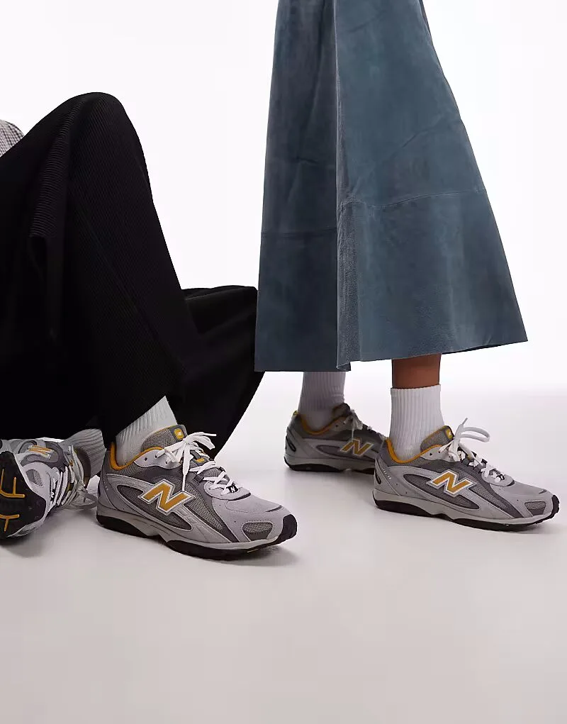 Унисекс кроссовки New Balance 204L из серой и желтой замши