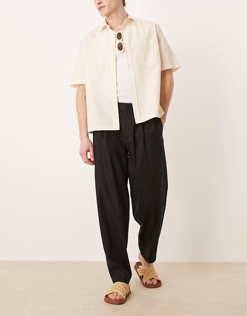 

Элегантные зауженные брюки свободного кроя из льняной смеси со складкой спереди, черного цвета Asos Design