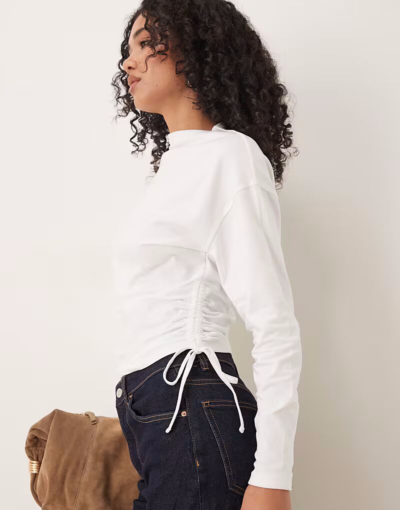 

Топ с длинными рукавами, завязками по бокам и сборками Asos Design, теплый белый