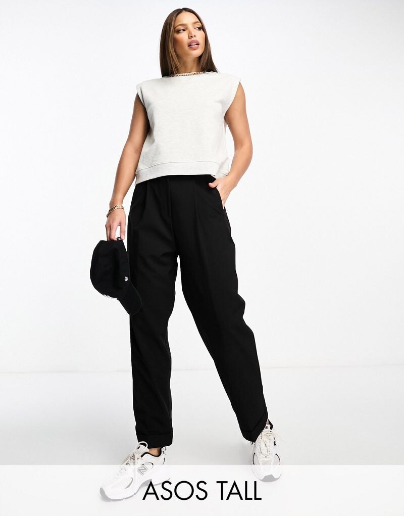 

Черные зауженные брюки с отворотом на подоле ASOS DESIGN Tall