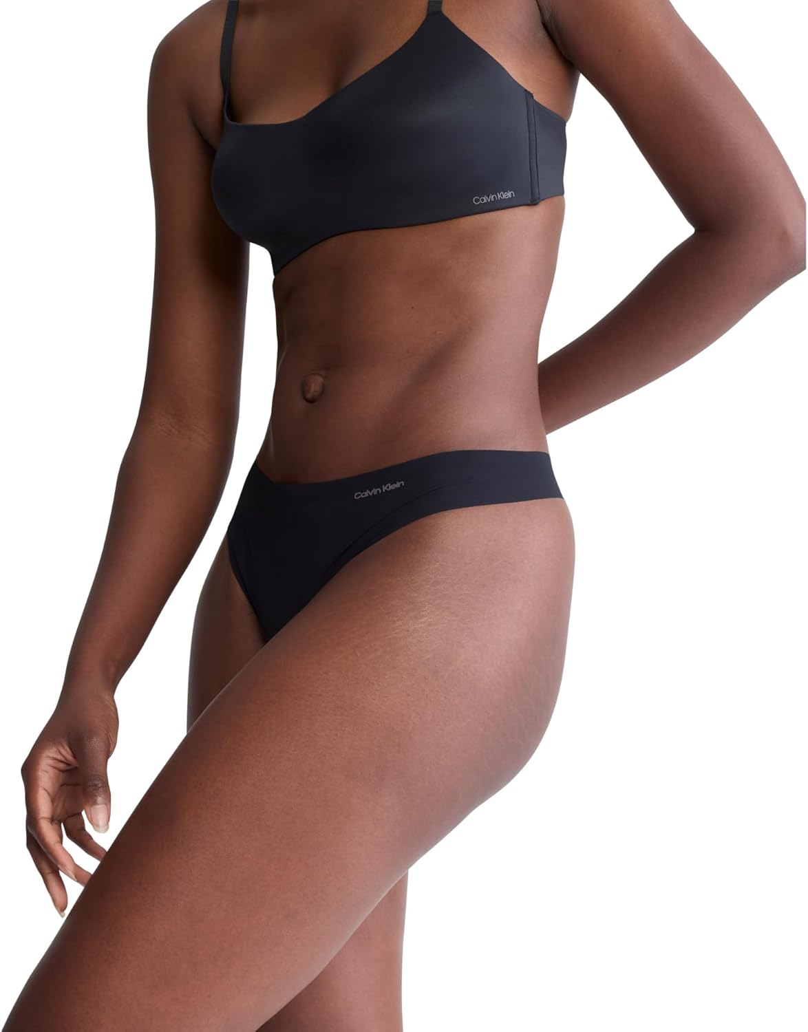 Женские бесшовные трусики-стринги Calvin Klein Invisibles, 3 шт., Black W. Smoke Logo/ Subdued W. Ivory Logo/ Prairie Peach — фото 3