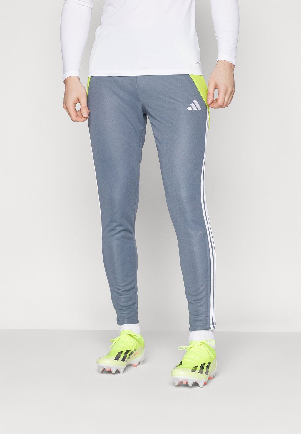 

Брюки для бега TIRO TRAINING PANT REGULAR adidas Performance, цвет team onix/team semi sol yellow