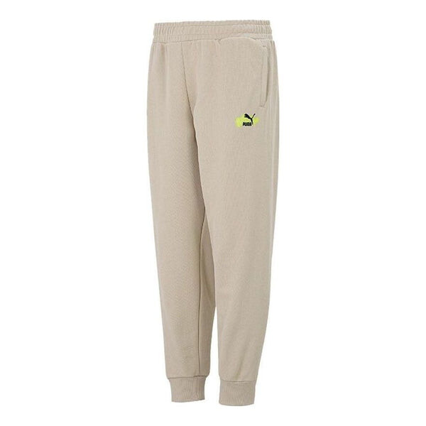 

Брюки trend graphic logo pants 'beige' Puma, бежевый