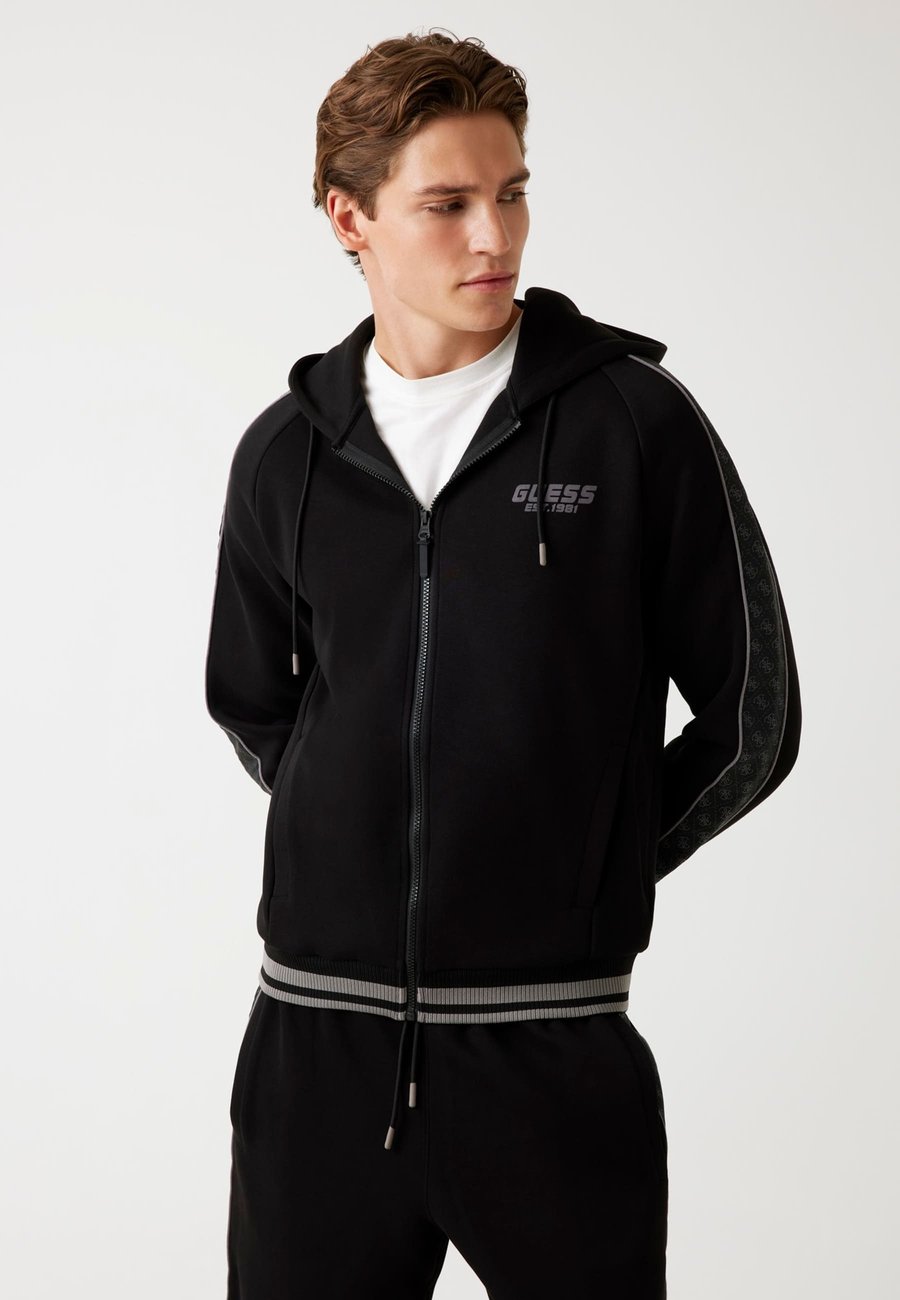 

Толстовка Guess KAPUZE, Schwarz/Black