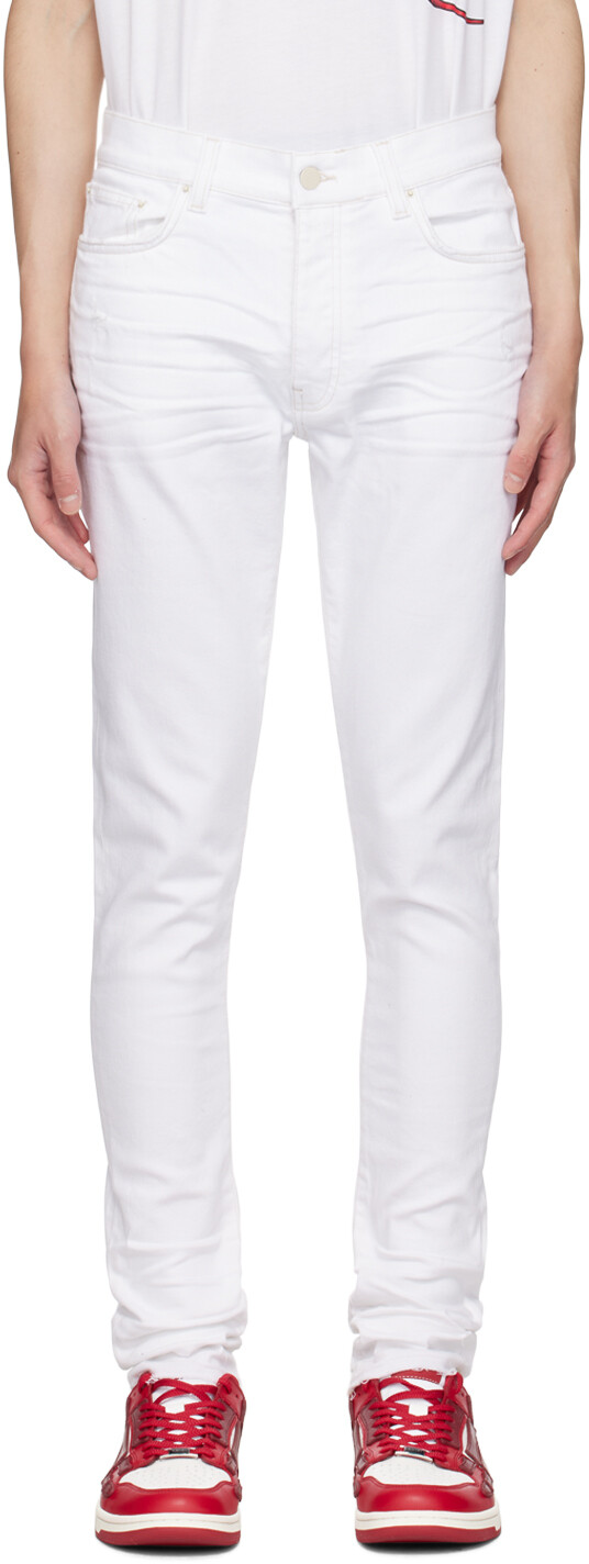 

Выпущенные джинсы Hem Skinny AMIRI